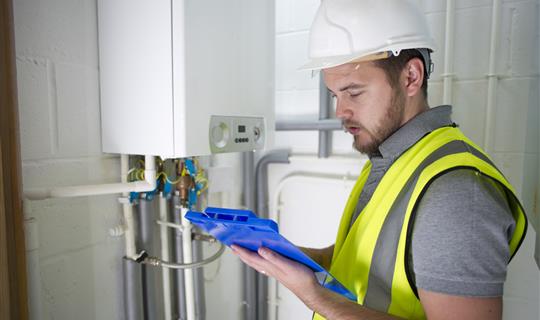 HVAC man testing boilder